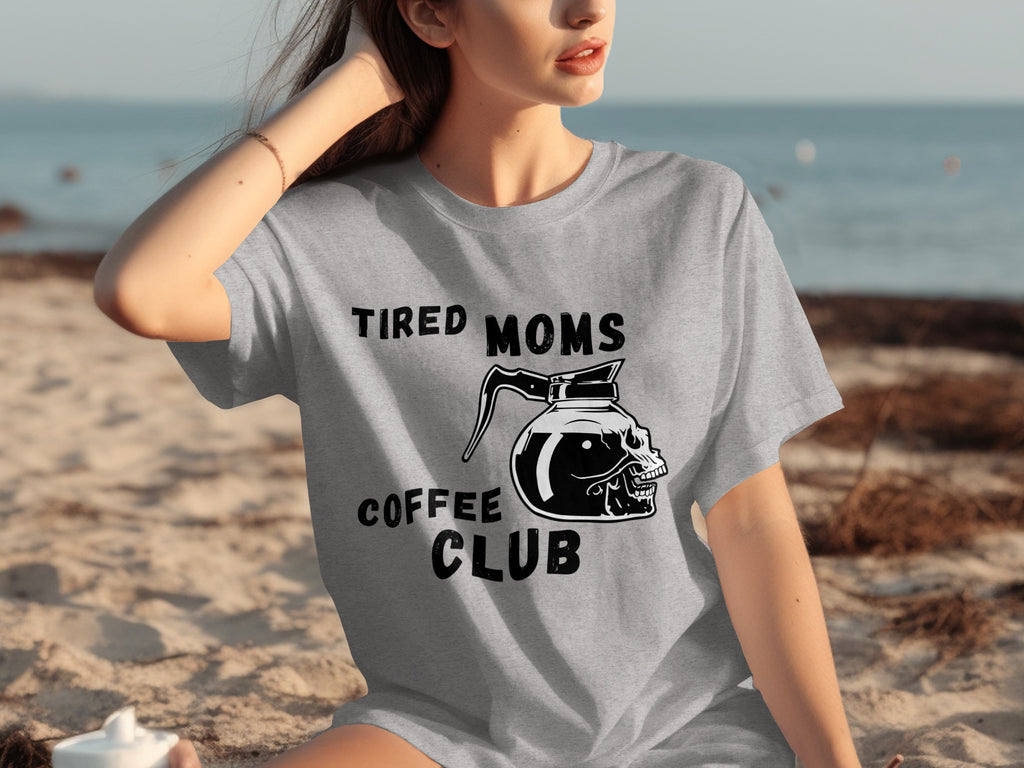 Gray t-shirt with "Tired Moms Coffee Club" text and skull coffee pot graphic.
