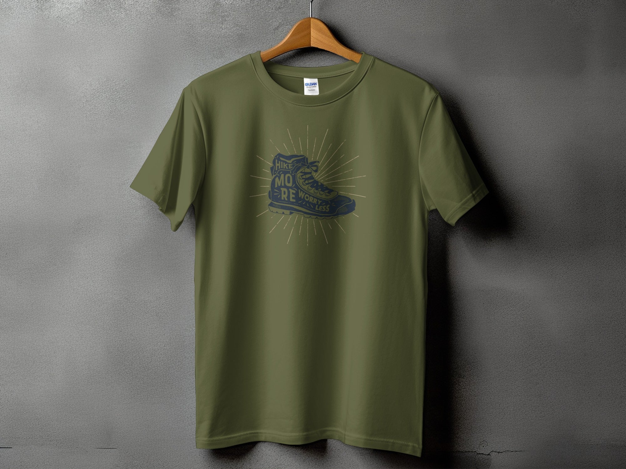 Olive green t-shirt with a vintage hiking boot graphic and text.