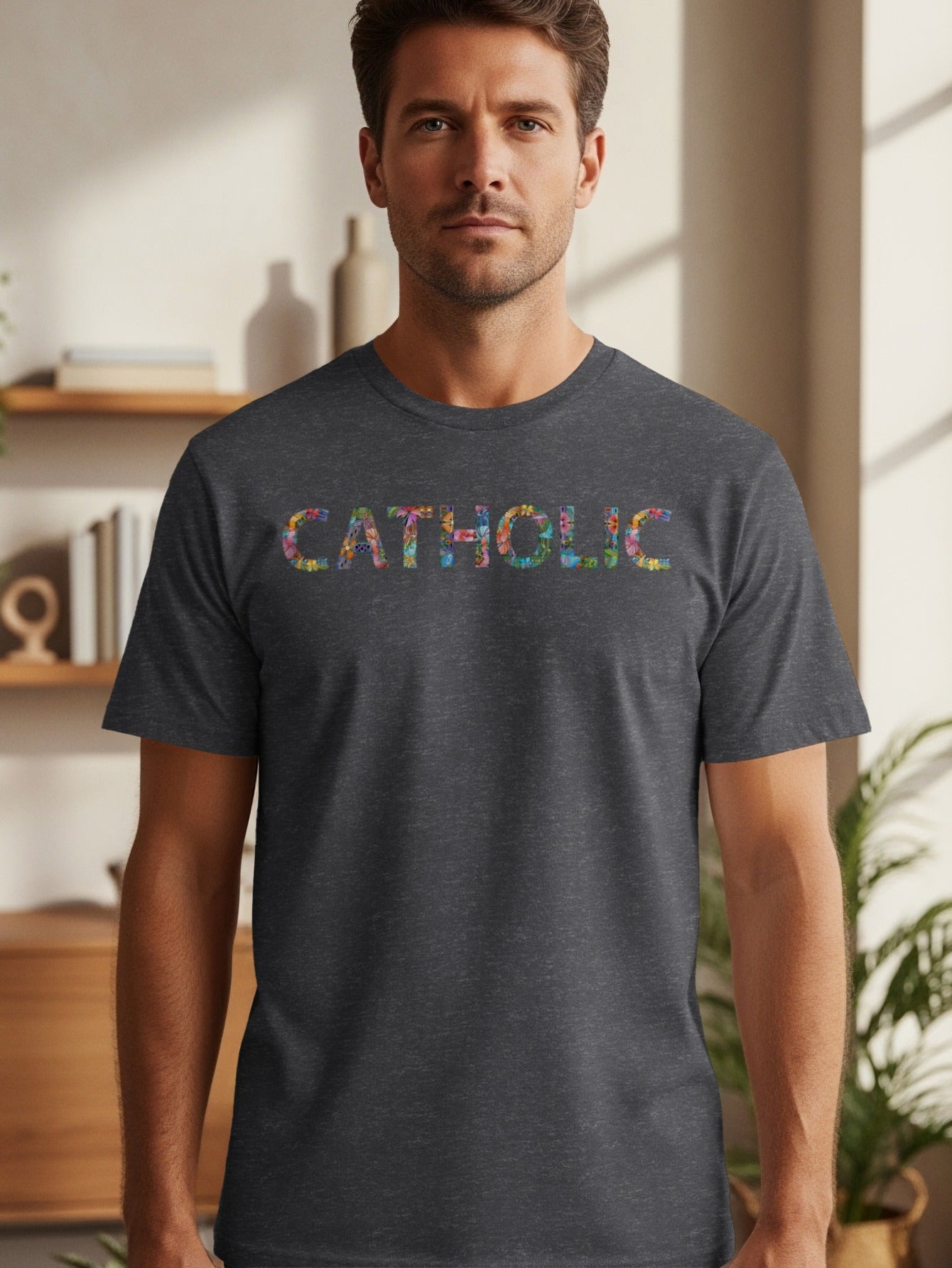 Dark gray t-shirt with colorful floral letters spelling "CATHOLIC".