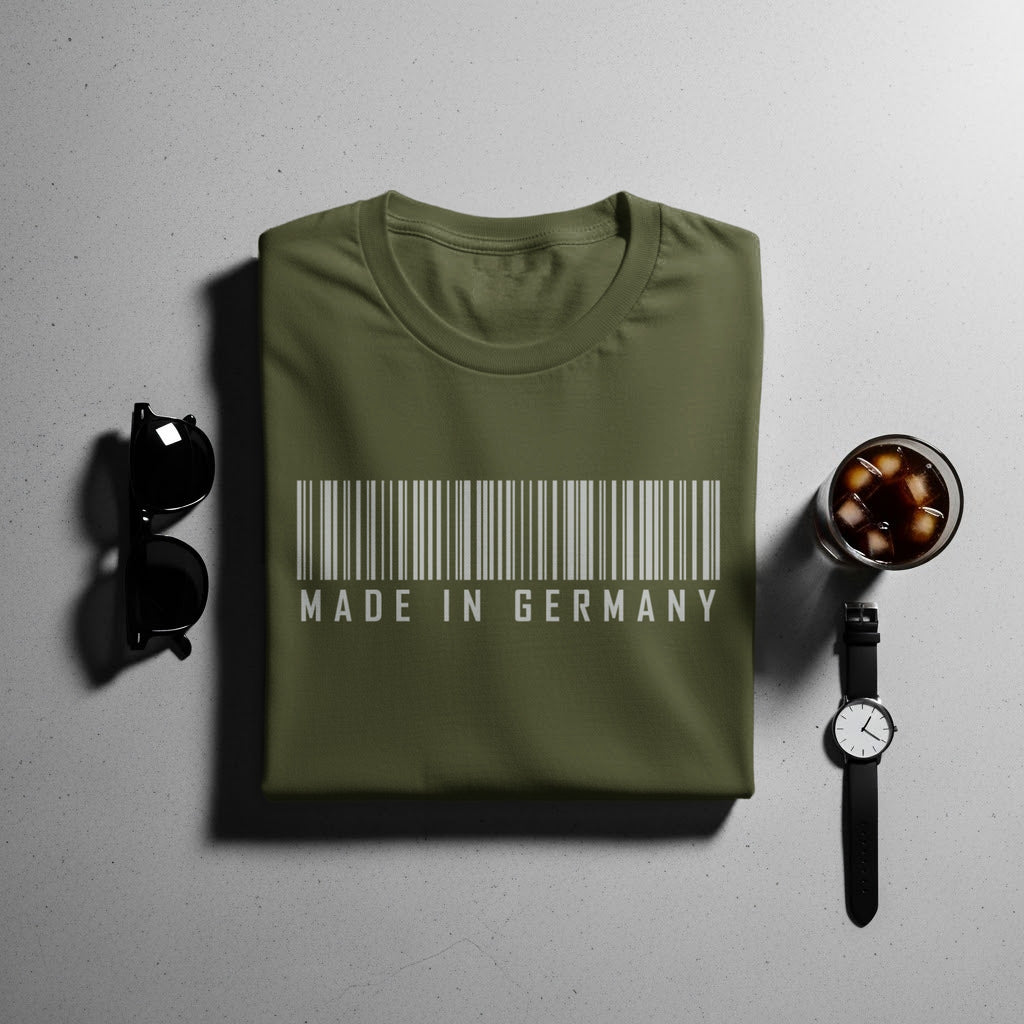 Green t-shirt with barcode and "MADE IN GERMANY" text.