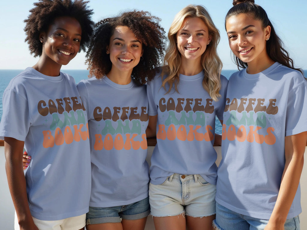 Four women in light blue t-shirts with "Coffee and Books" graphic stand outdoors.