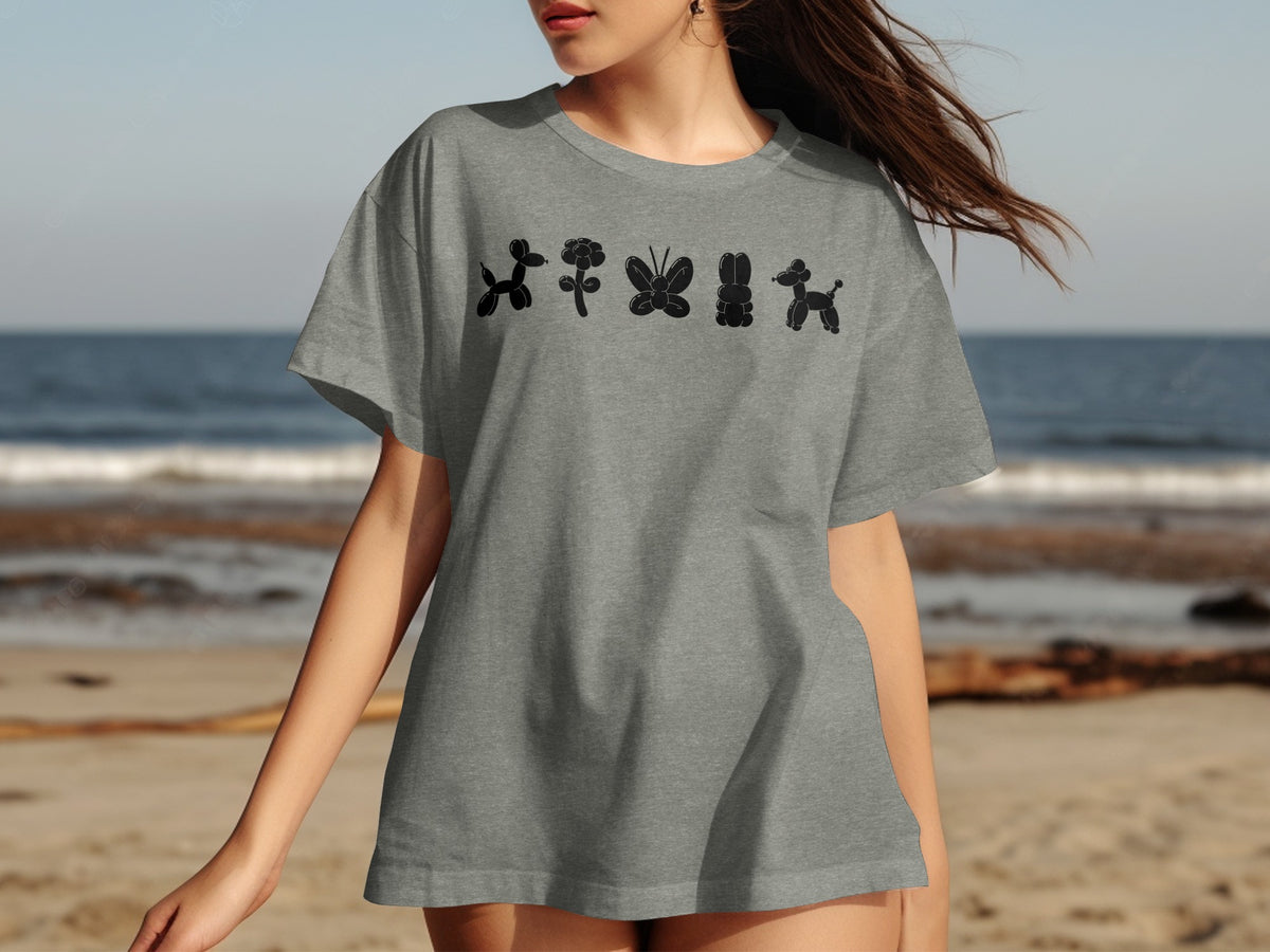 Grey t-shirt with black balloon animal designs of a dog, flower, butterfly, bunny, and dog.