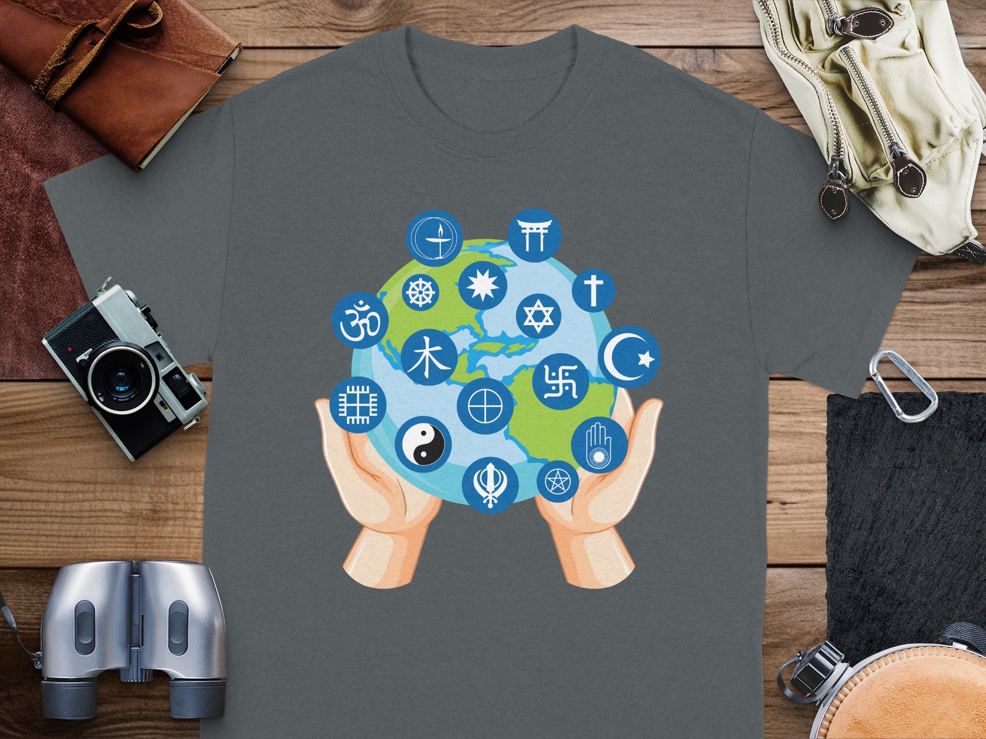 Hands hold Earth with symbols of various religions and beliefs.