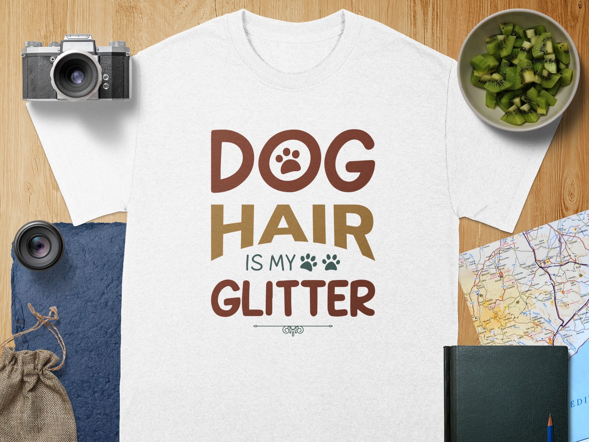 White t-shirt with "DOG HAIR IS MY GLITTER" text and paw prints.