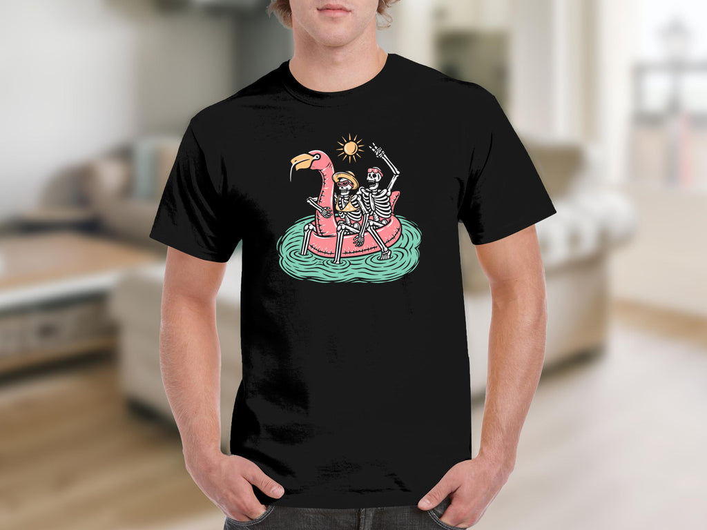 Two skeletons ride a pink flamingo float under a smiling sun.