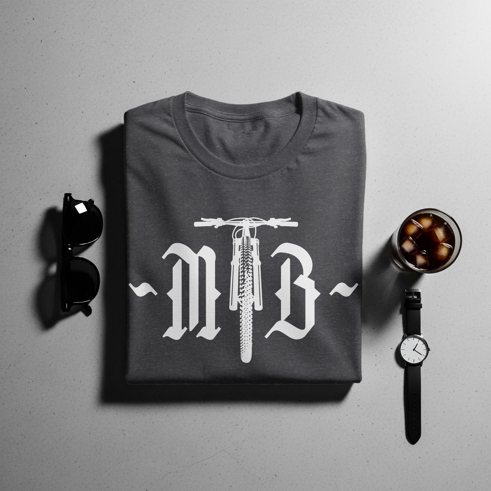 Dark grey t-shirt with white graphic of a bicycle front and old english letters.