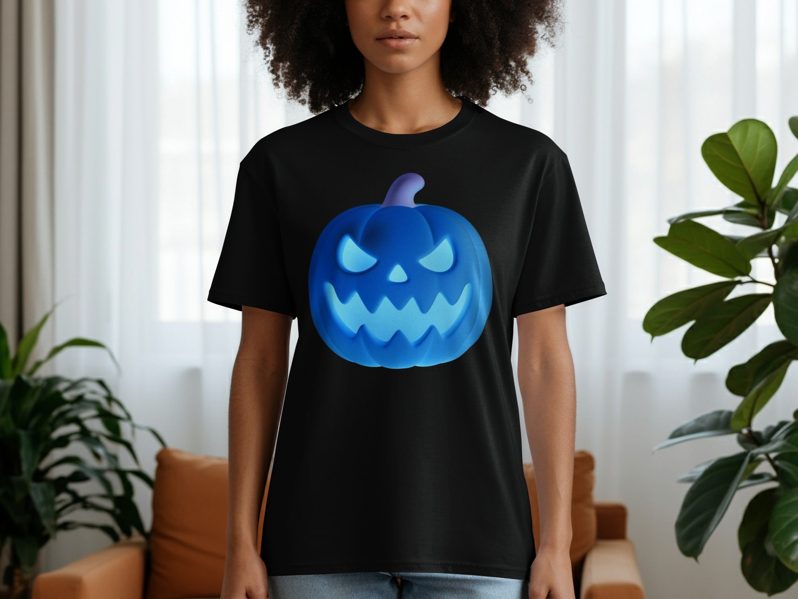 Black t-shirt on a person featuring a glowing blue jack-o'-lantern graphic.