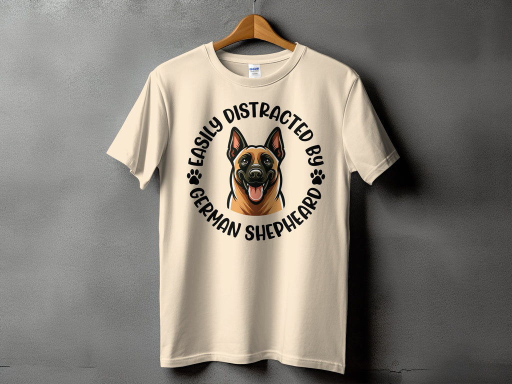 Light beige t-shirt with a German Shepherd illustration and "Easily Distracted By German Shepherd" text.