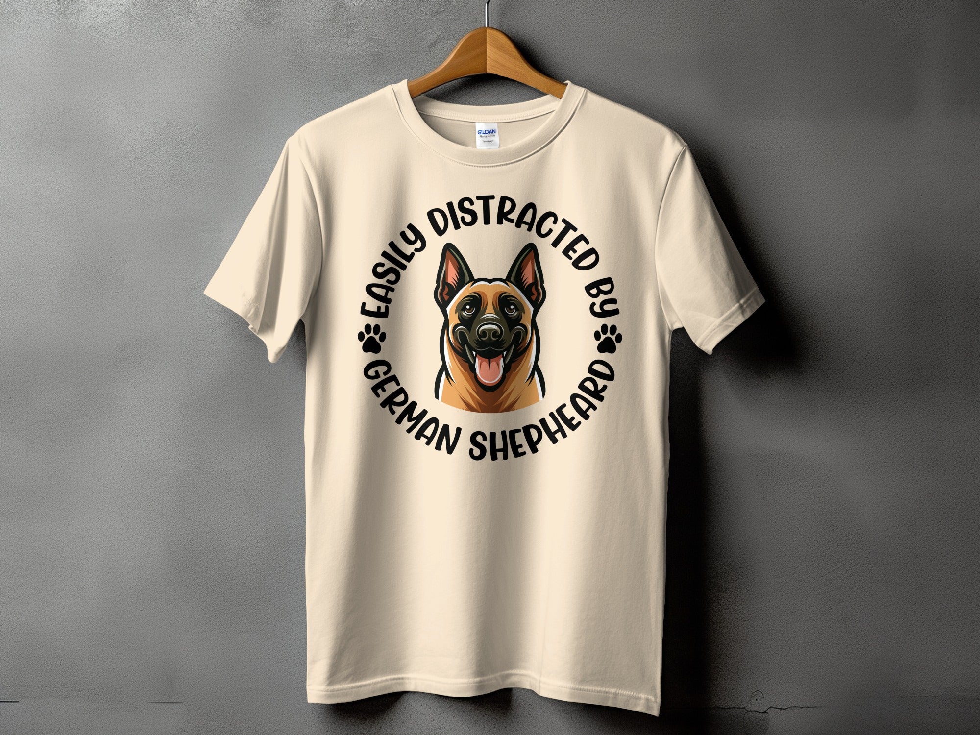 Light beige t-shirt with a German Shepherd illustration and "Easily Distracted By German Shepherd" text.