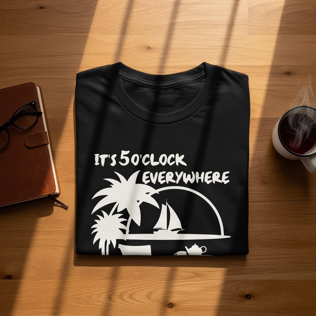 Black t-shirt with white text "IT'S 5 O'CLOCK EVERYWHERE" and tropical graphics.
