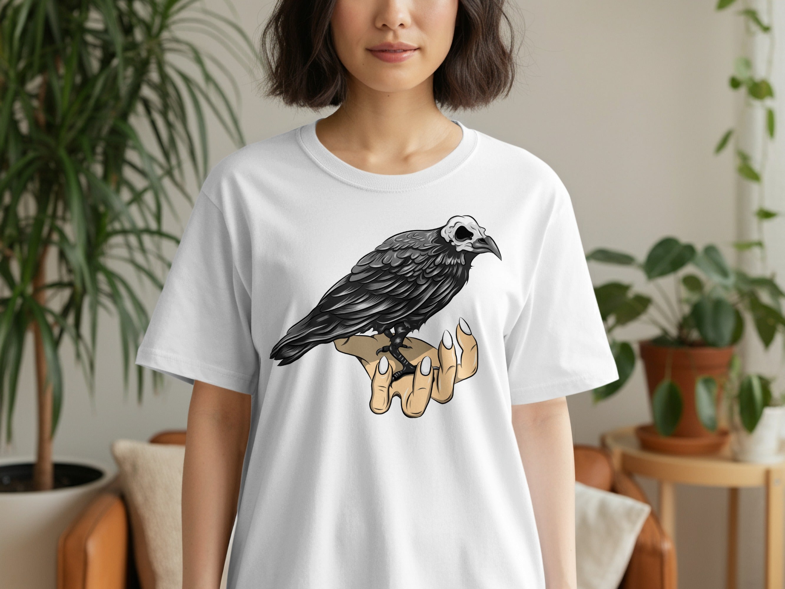 White t-shirt with black crow skeleton graphic on right chest.