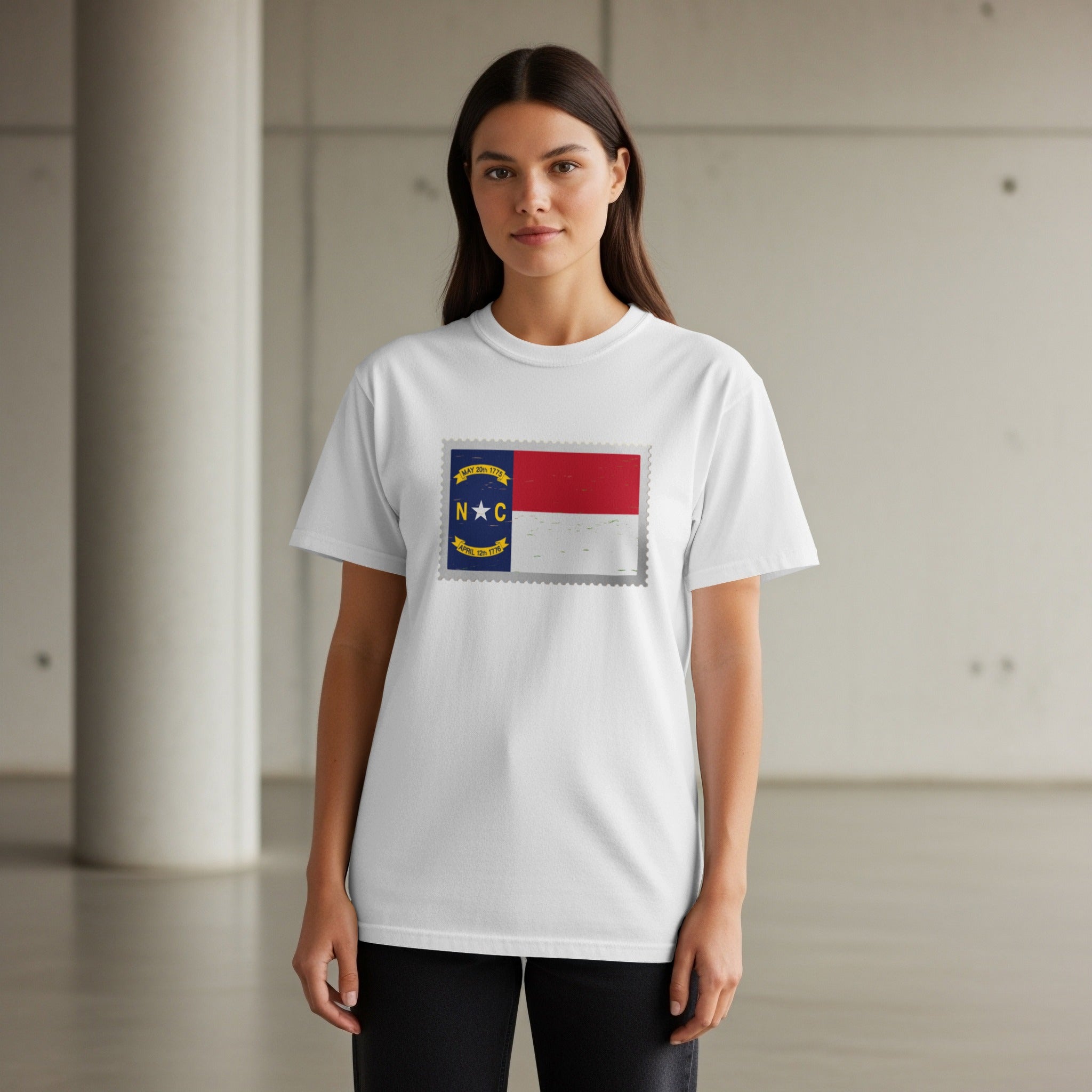 White t-shirt with North Carolina flag postage stamp graphic.
