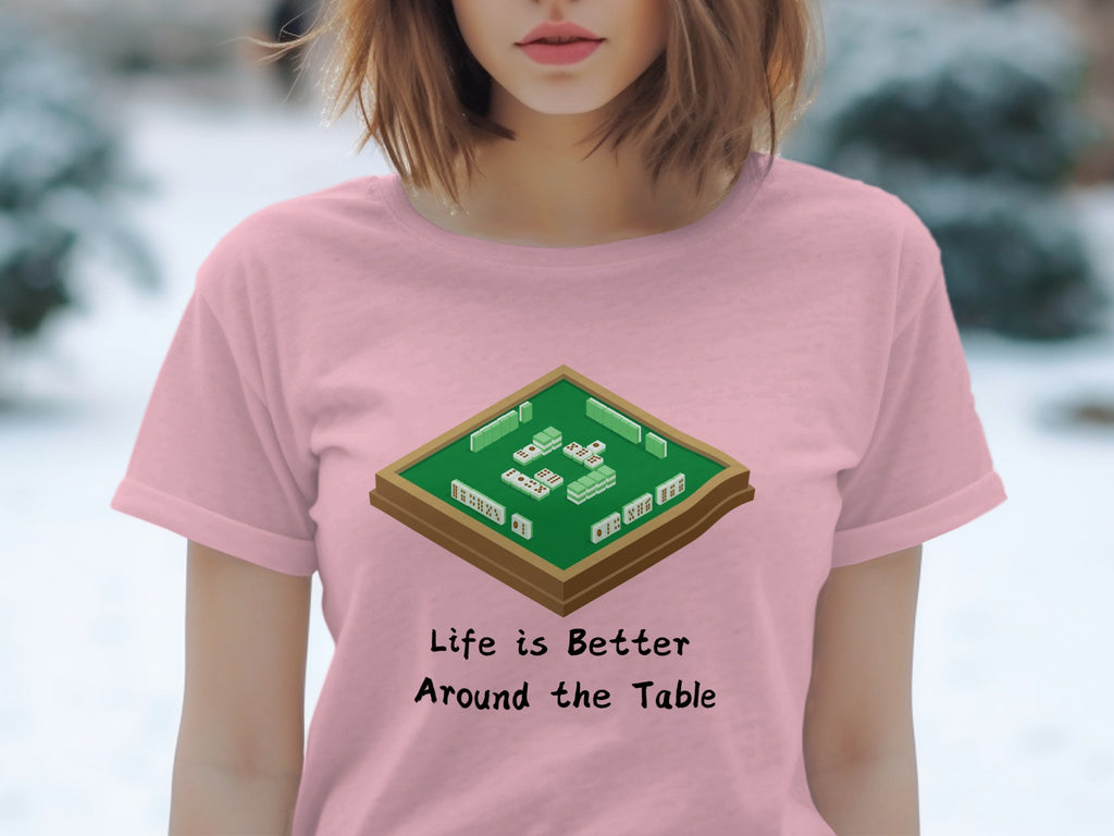 Pink t-shirt with mahjong set graphic and text: "Life is Better Around the Table"