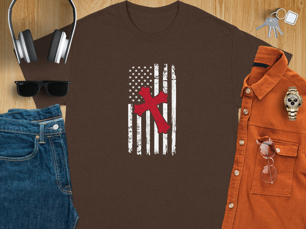 Brown t-shirt with distressed American flag and red cross graphic.