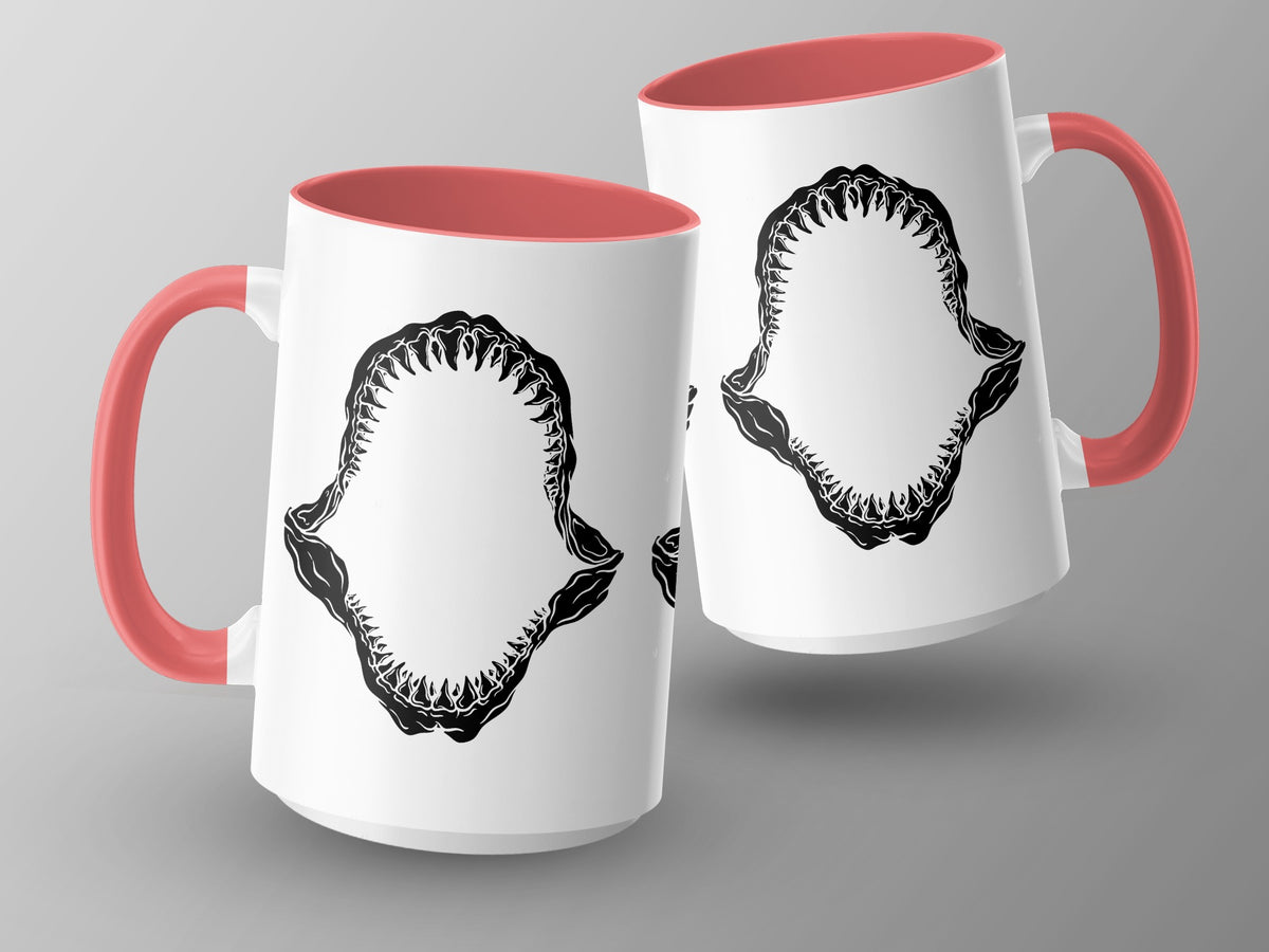 Two white mugs with red handles feature black shark jaw graphics.