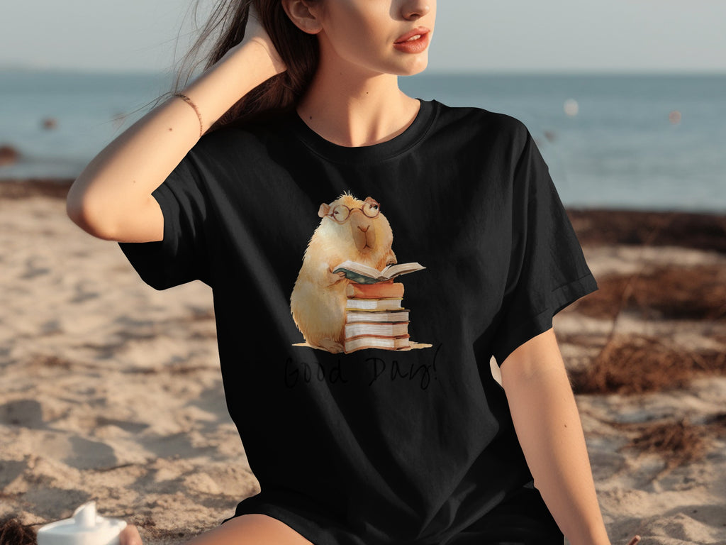 Black t-shirt with watercolor illustration of a hamster reading books, saying "Good Day!".