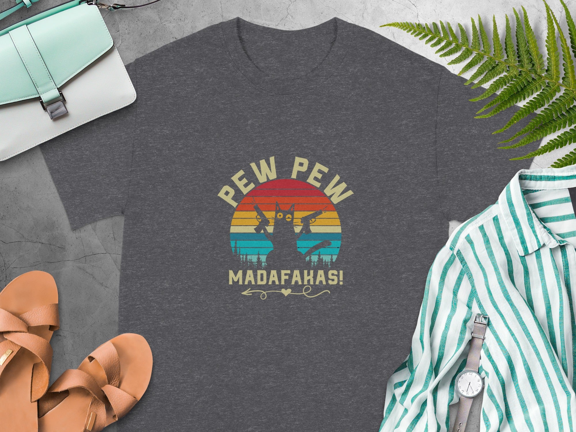 Dark grey t-shirt with a distressed graphic of two cats holding guns and the text "Pew Pew Madafakas!".
