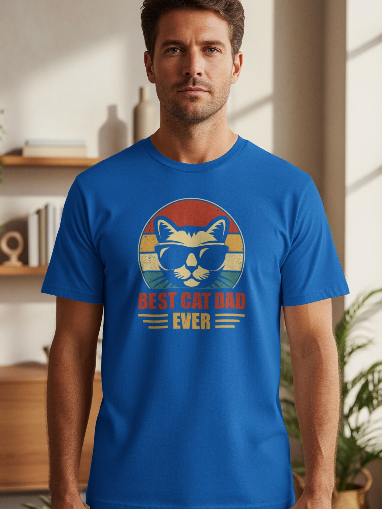 Blue t-shirt with a cat wearing sunglasses and the text "Best Cat Dad Ever".