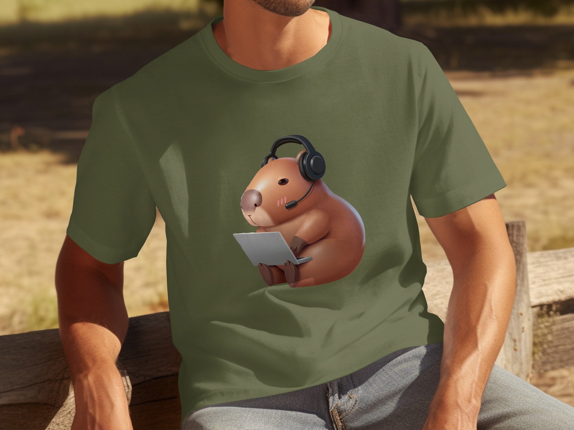 T-shirt graphic with a capybara wearing headphones and using a laptop.