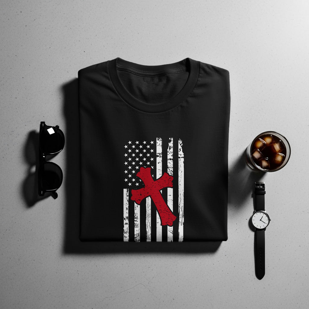 Black t-shirt with distressed US flag and red cross graphic.