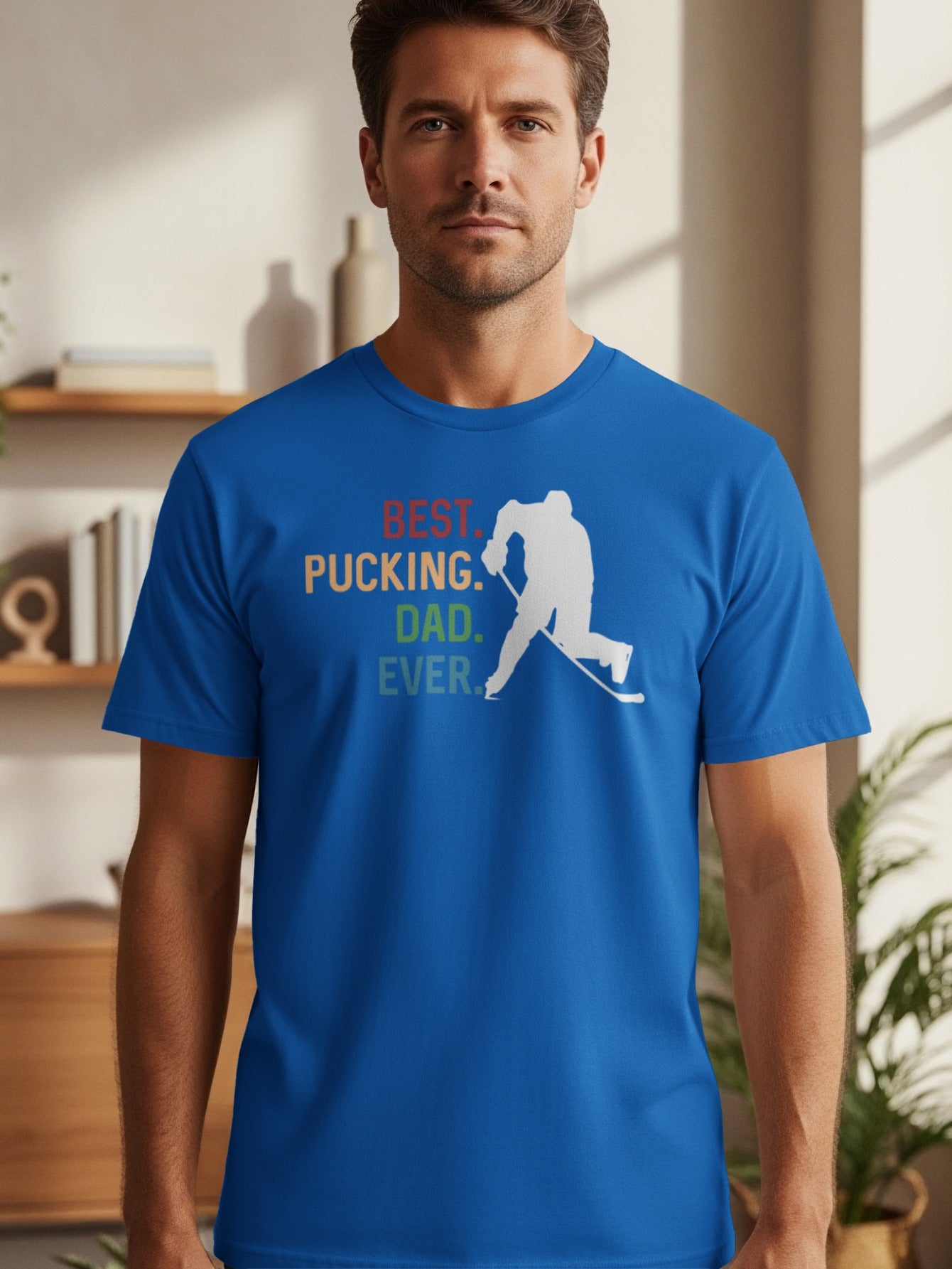 Blue t-shirt with white hockey player silhouette and text "BEST. PUCKING. DAD. EVER."