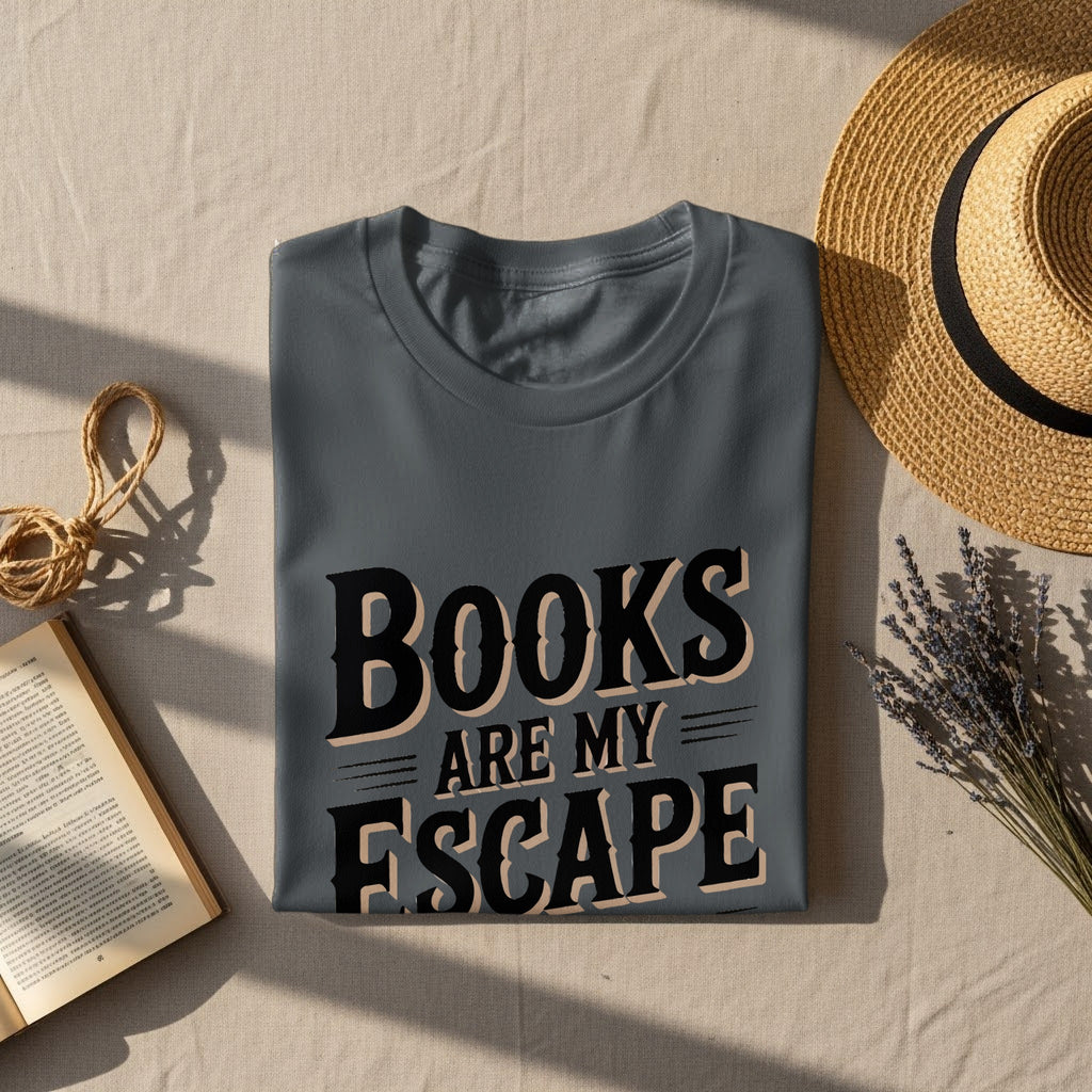 Gray t-shirt with text "BOOKS ARE MY ESCAPE" on a textured surface.