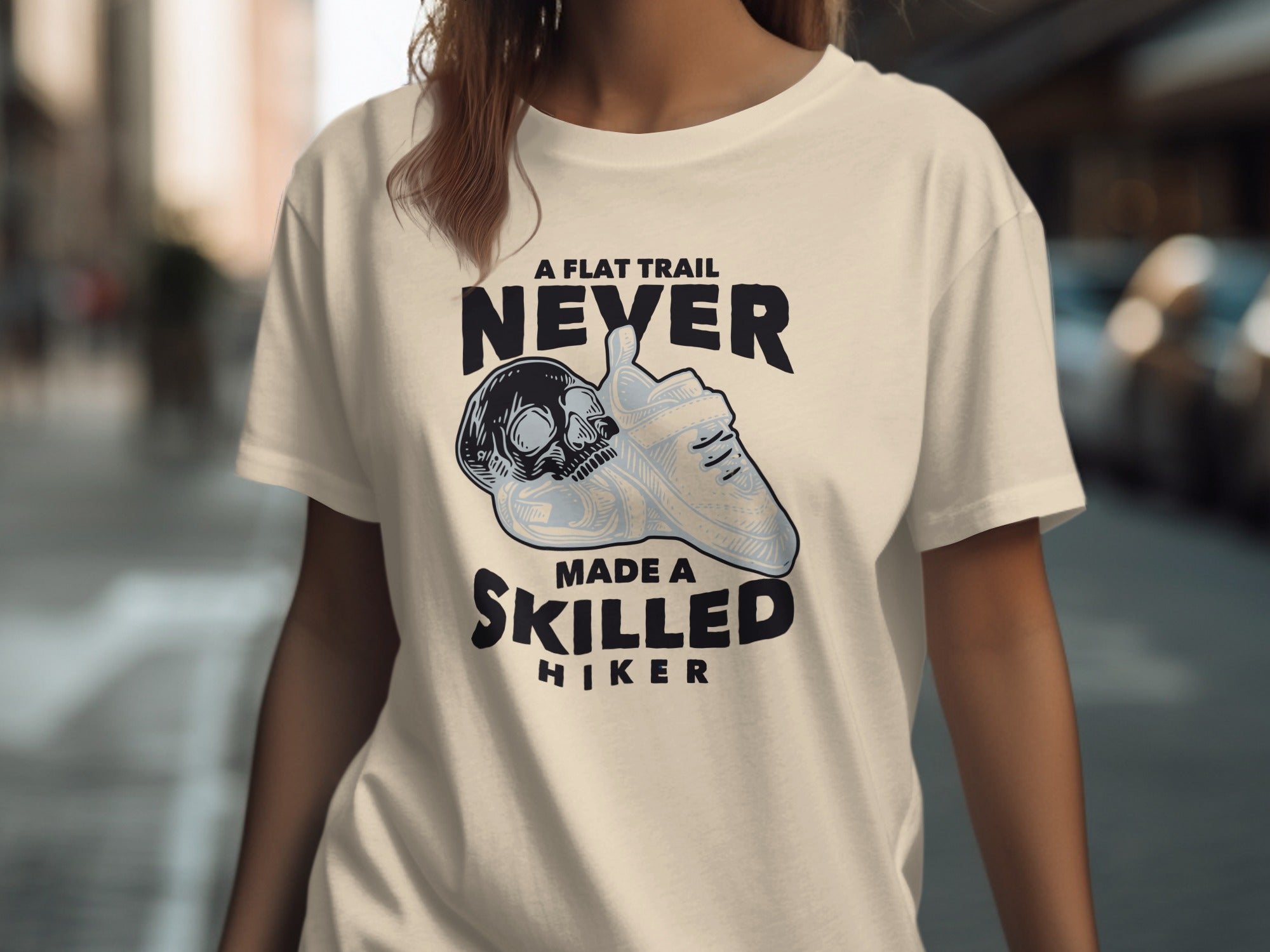 A flat trail never made a skilled hiker quote with skull and hiking boot graphic.