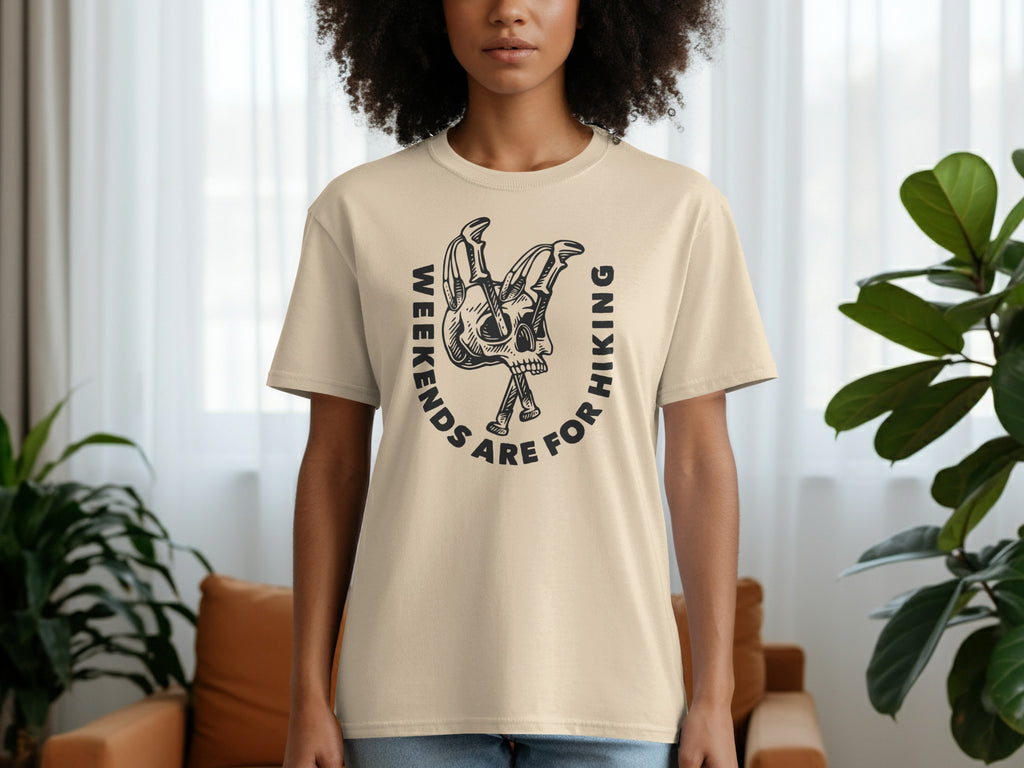 Cream t-shirt with black graphic of skull and hiking poles, text "Weekends Are For Hiking".