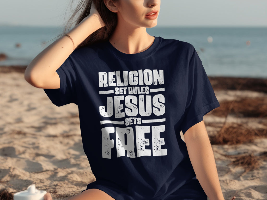 Navy t-shirt with white text "RELIGION SET RULES JESUS SETS FREE"