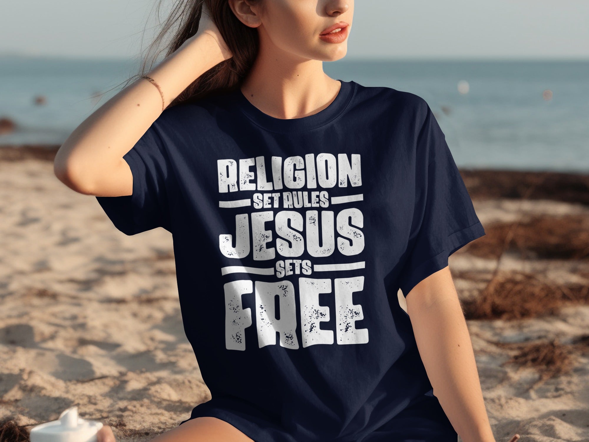 Navy t-shirt with white text "RELIGION SET RULES JESUS SETS FREE"