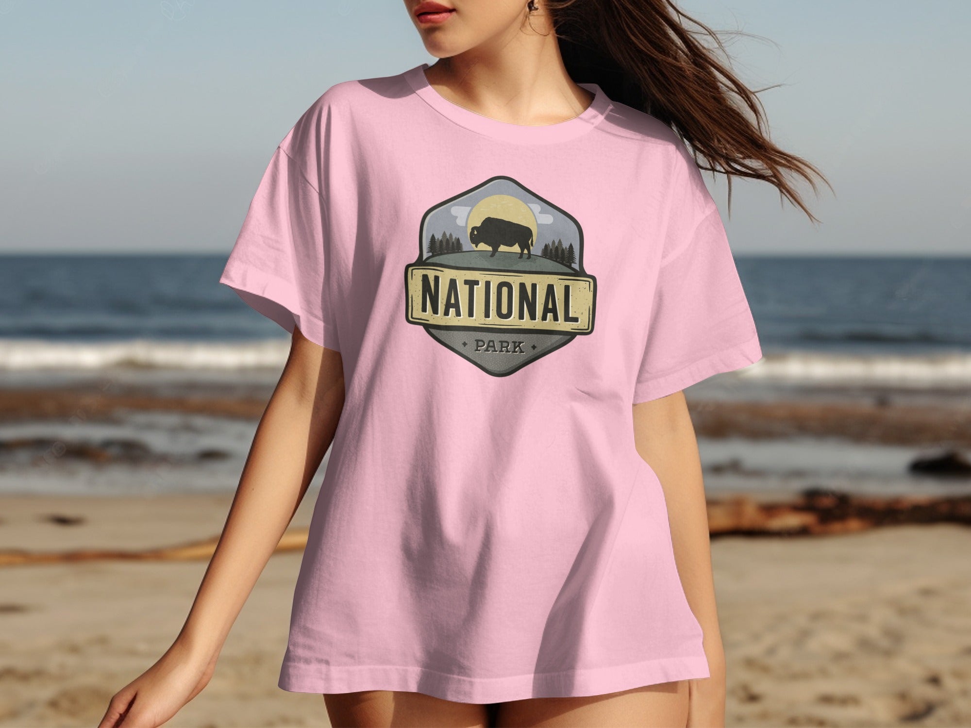 Pink t-shirt with a "National Park" logo featuring a bison silhouette.