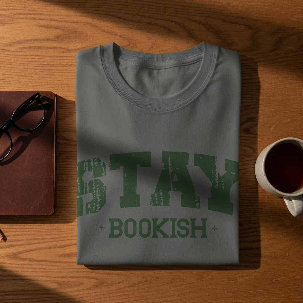Grey t-shirt with distressed green text "STAY + BOOKISH".