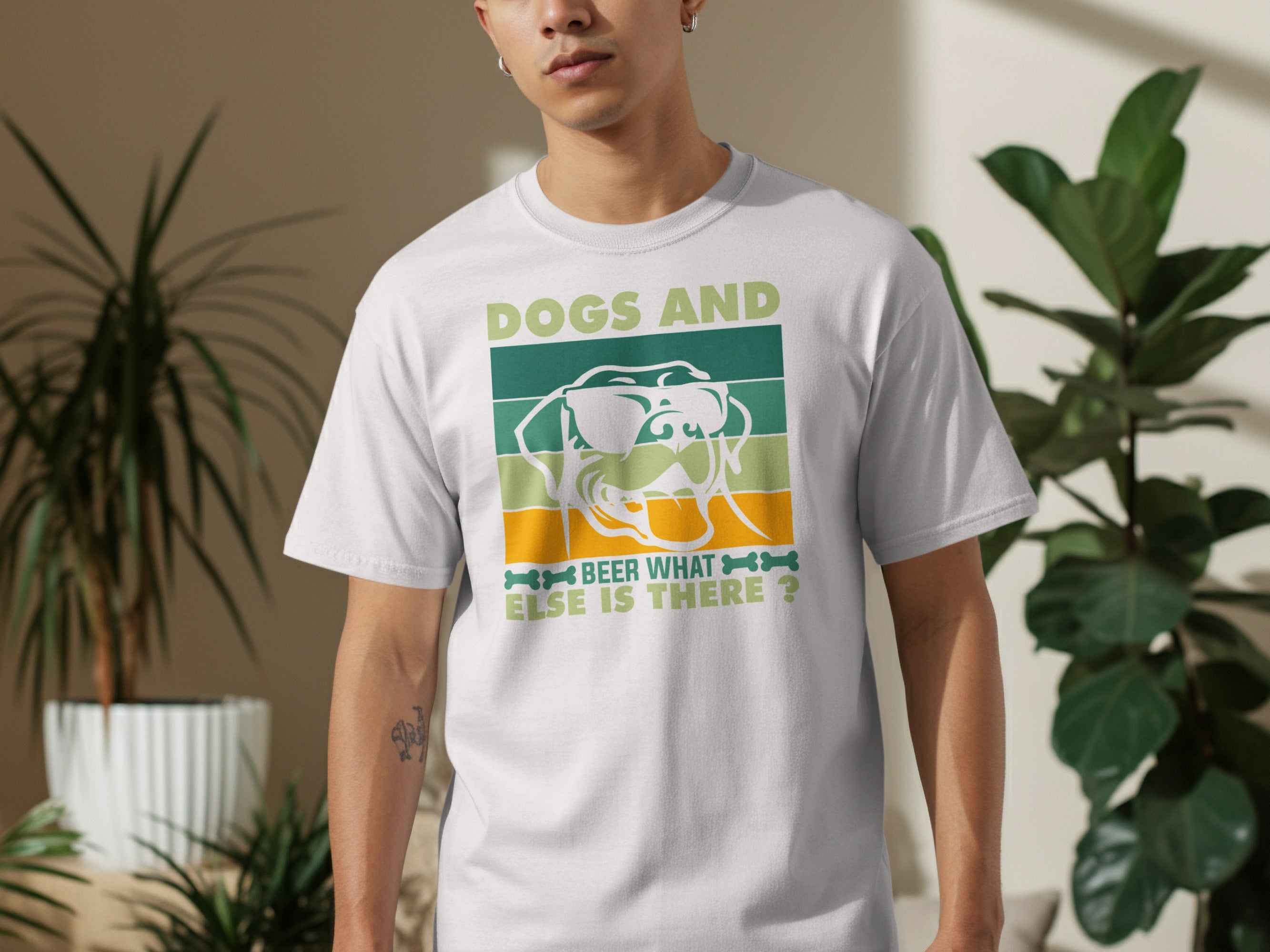 White t-shirt with graphic text "DOGS AND BEER WHAT ELSE IS THERE" and dog face.
