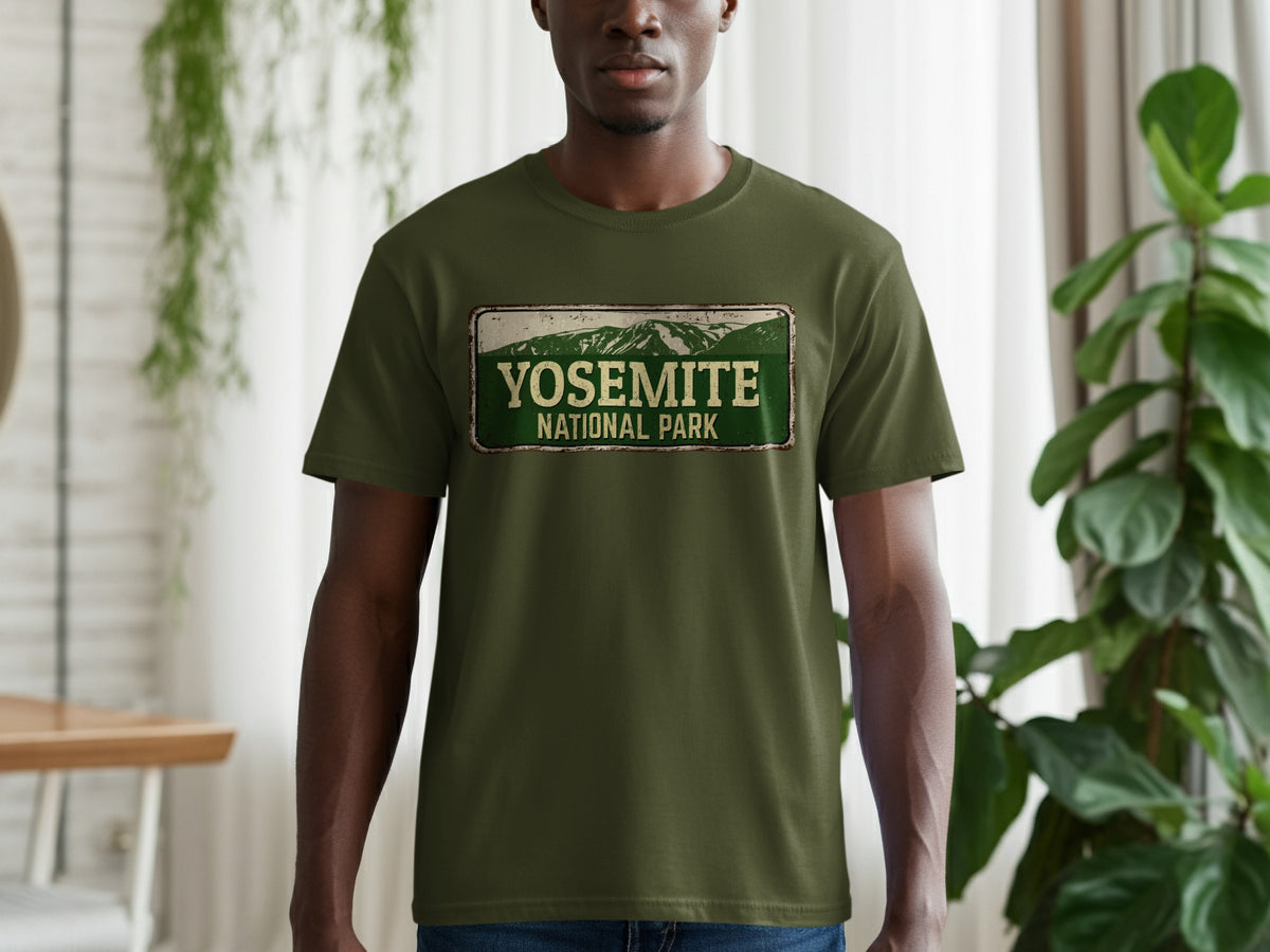 Green t-shirt with Yosemite National Park distressed graphic on chest.