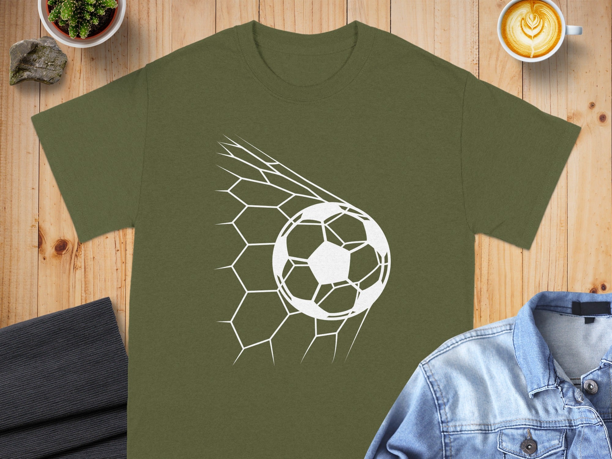 Olive green t-shirt with a white soccer ball in a net graphic.