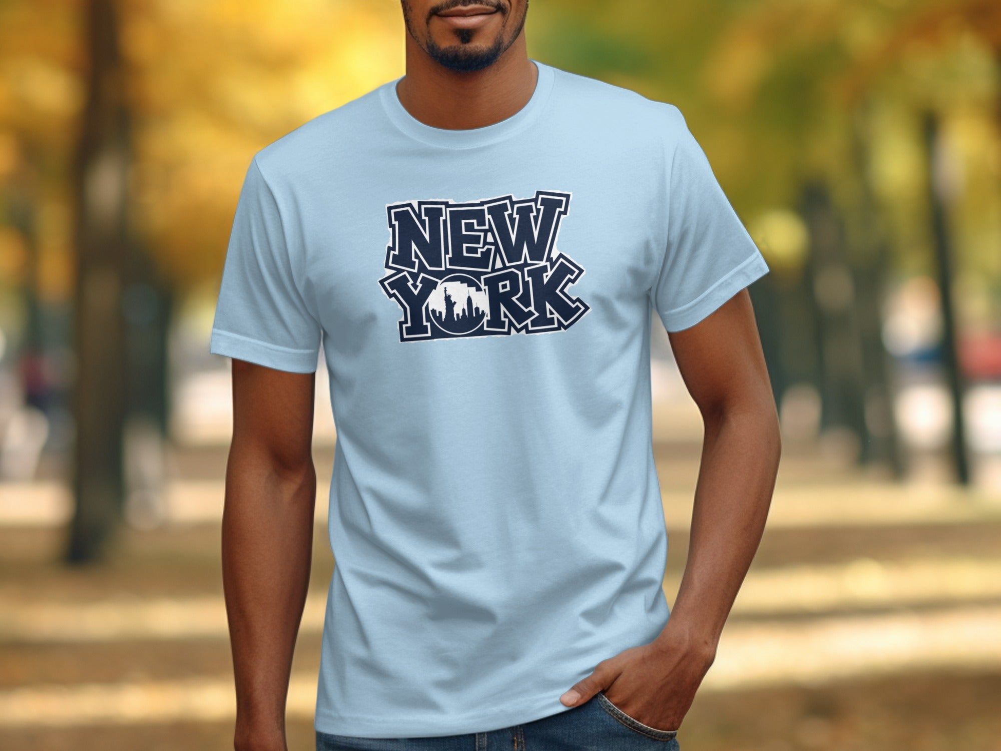 Light blue t-shirt with navy "New York" text and skyline graphic.