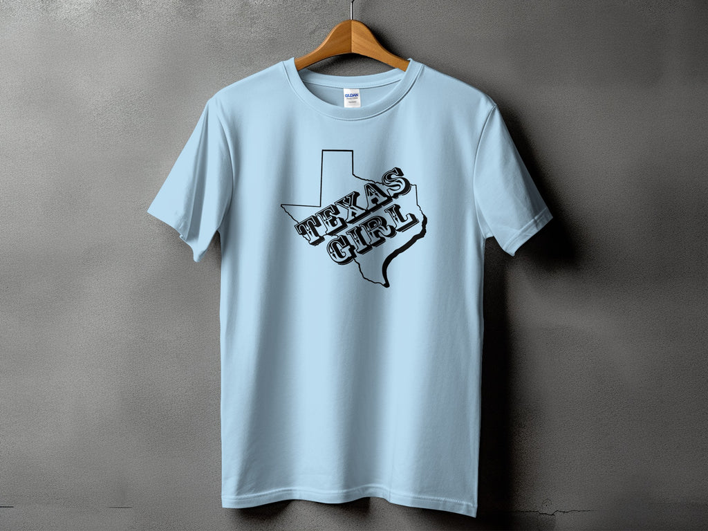 Light blue t-shirt with black "Texas Girl" text inside the outline of Texas.