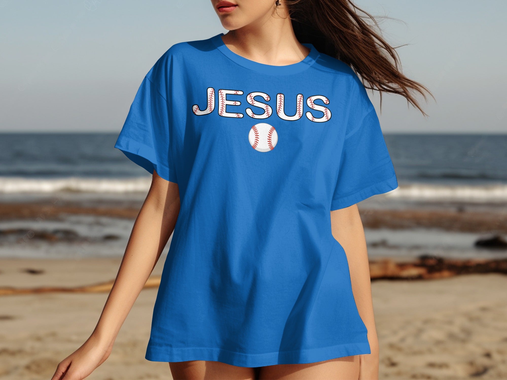 Blue t-shirt with white text "JESUS" and a baseball graphic.