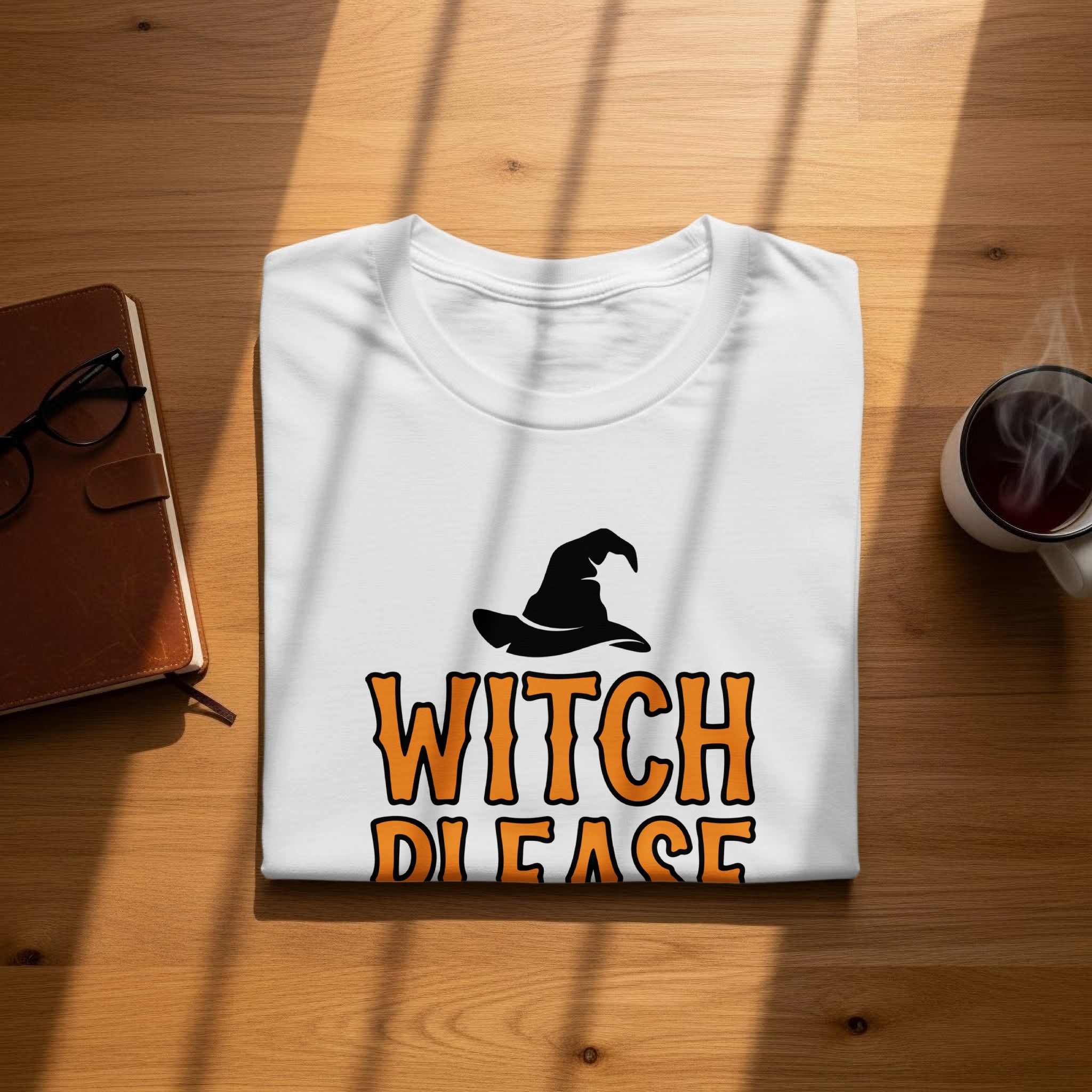 White t-shirt with black witch hat and orange text reading "WITCH PLEASE".