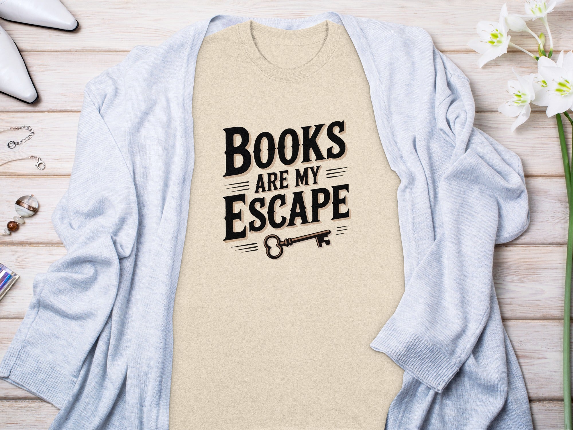 Tan t-shirt with "Books Are My Escape" and a key graphic.