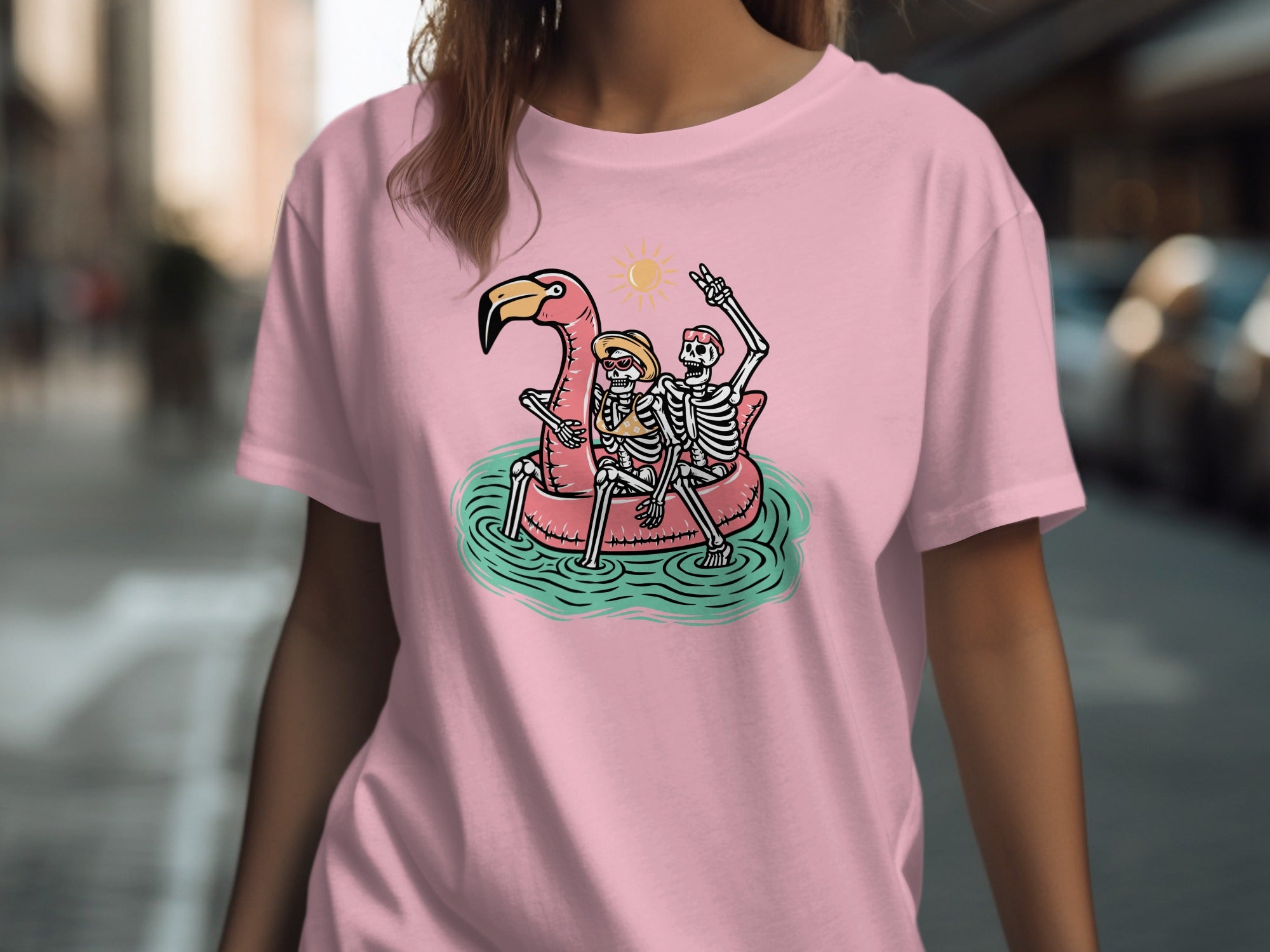 Two skeletons riding a pink flamingo float under a sun.