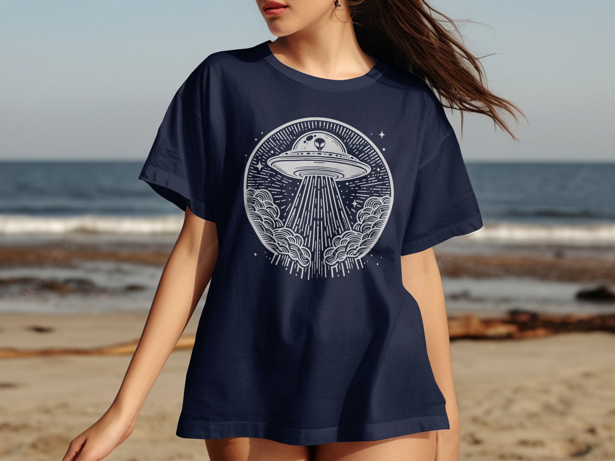 Navy t-shirt with a white circular graphic of a UFO beaming light onto clouds.