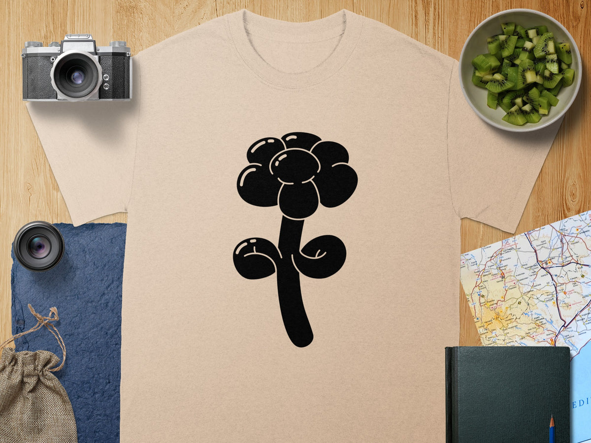 Beige t-shirt with a black balloon flower graphic in the center.