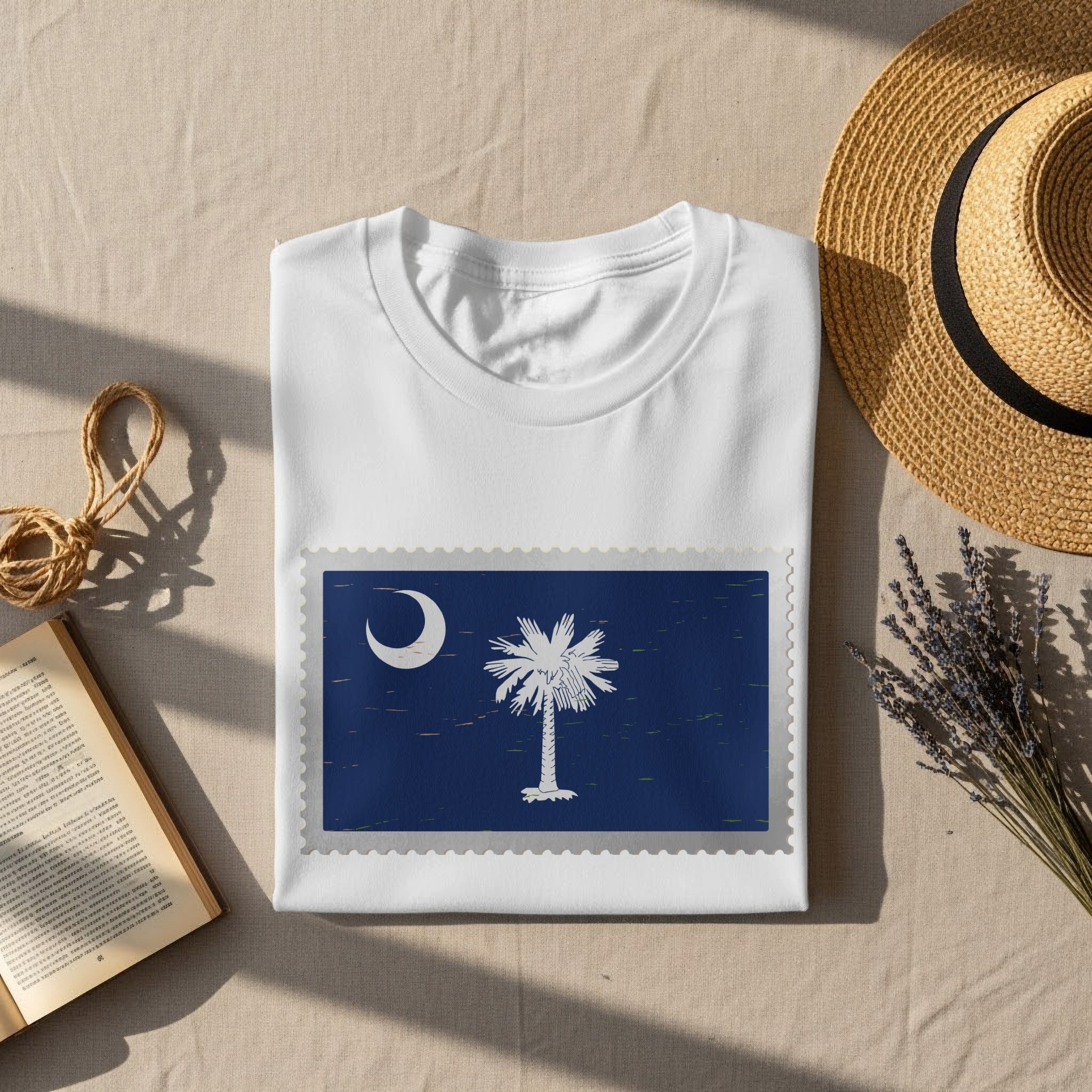 White t-shirt with South Carolina flag emblem displayed as postage stamp.