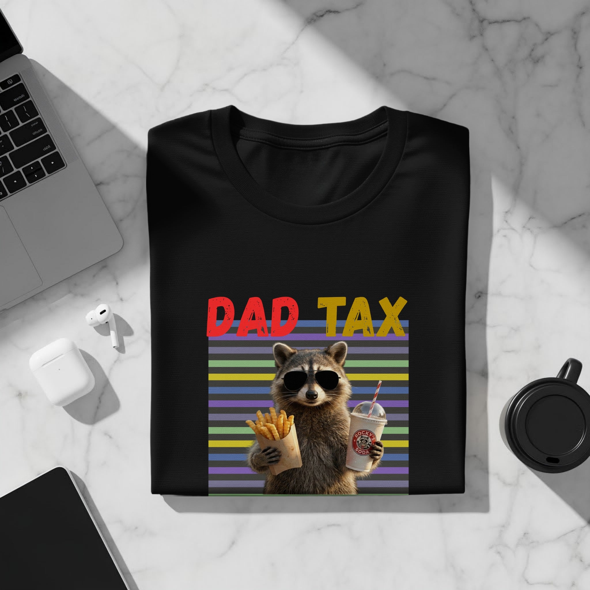 Black t-shirt with a raccoon wearing sunglasses holding french fries and soda, text "DAD TAX".