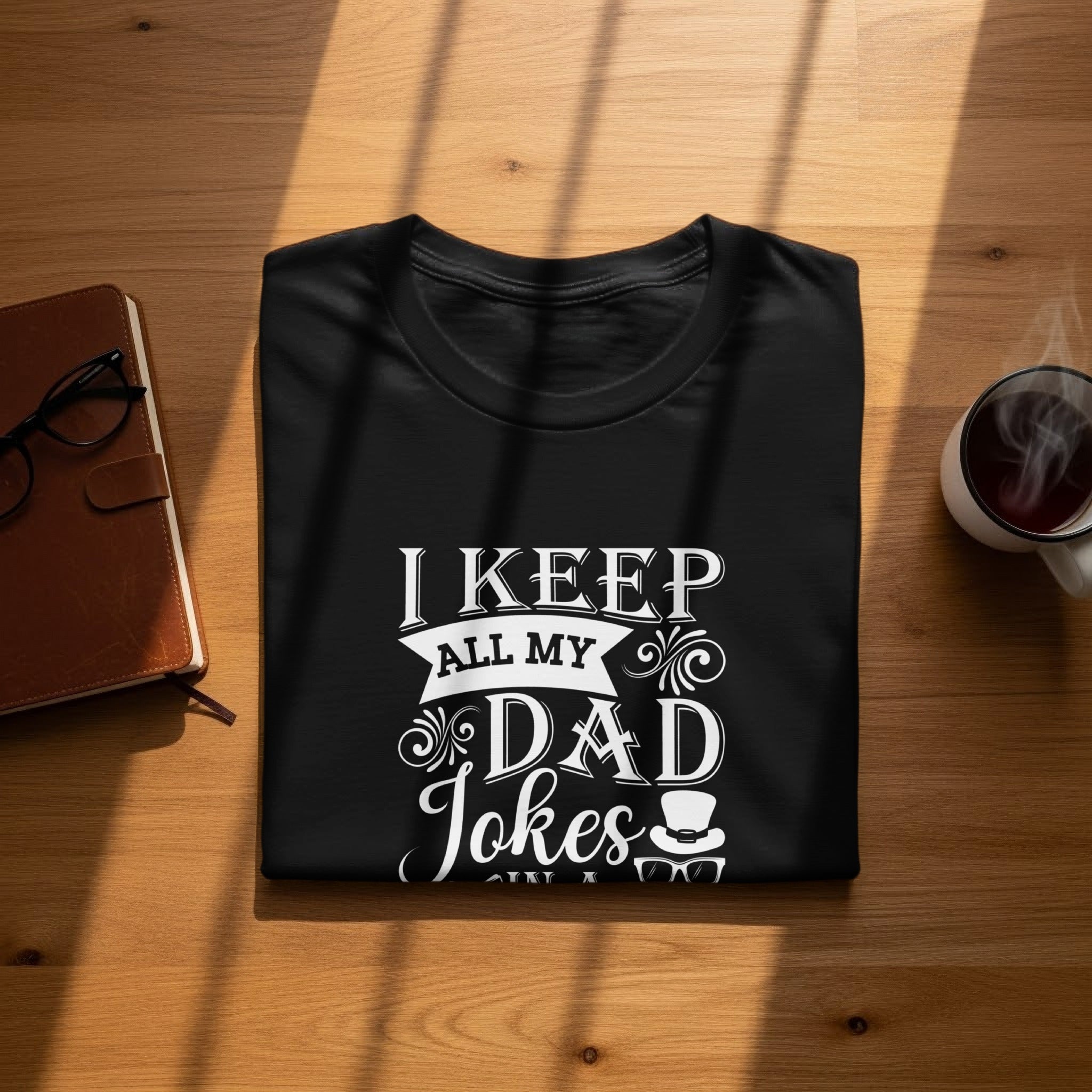 Black t-shirt with "I Keep All My Dad Jokes" text and graphics.
