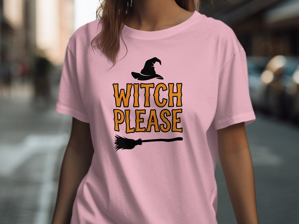 Pink t-shirt with witch hat, broom, and "WITCH PLEASE" text graphic.