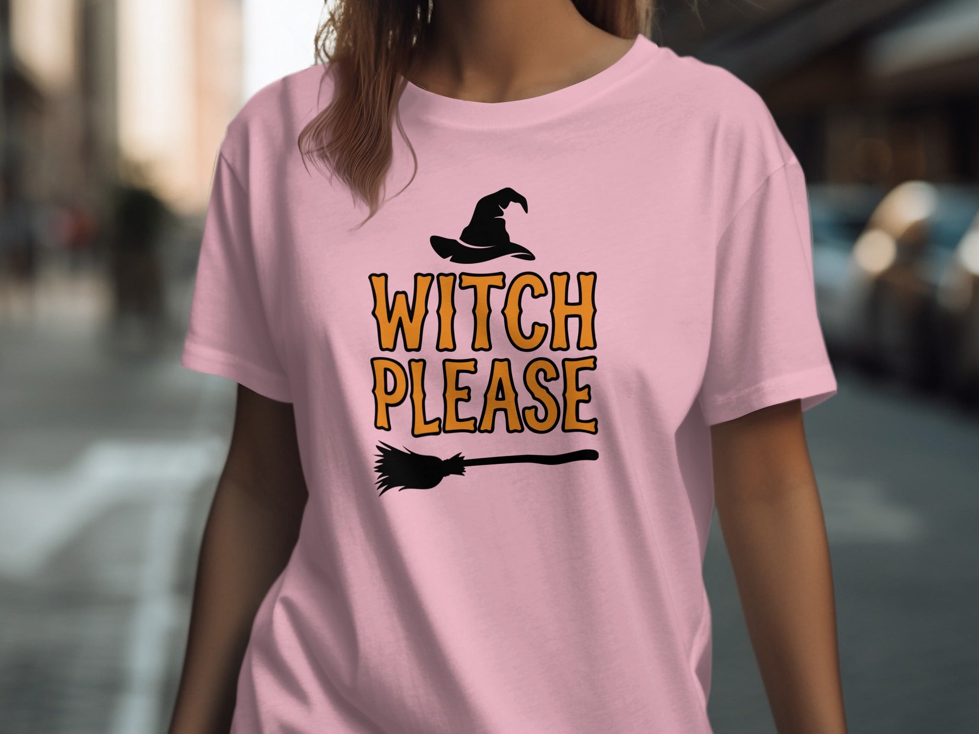 Pink t-shirt with witch hat, broom, and "WITCH PLEASE" text graphic.