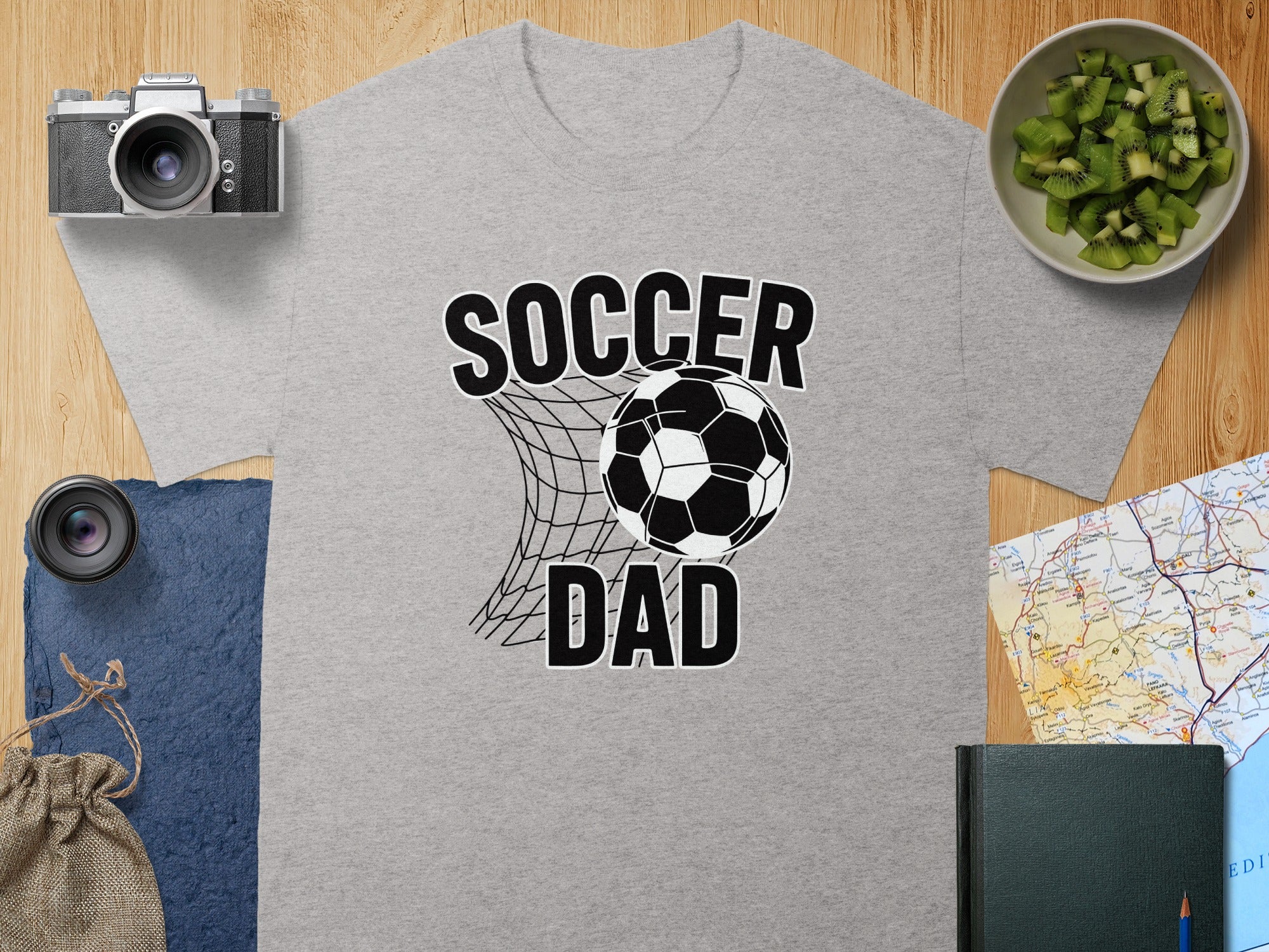 Grey t-shirt with "SOCCER DAD" text and a soccer ball in a net.