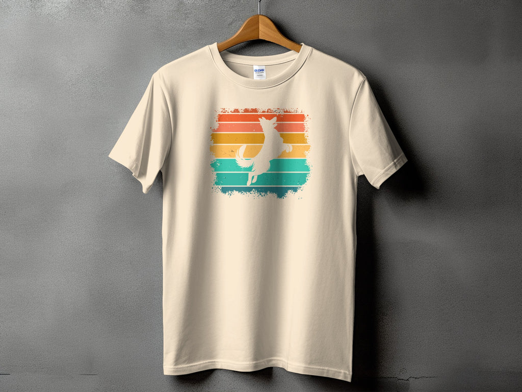 Cream t-shirt with a white dog silhouette on a retro sunset stripe background.